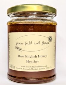 a jar of heather honey on a white background