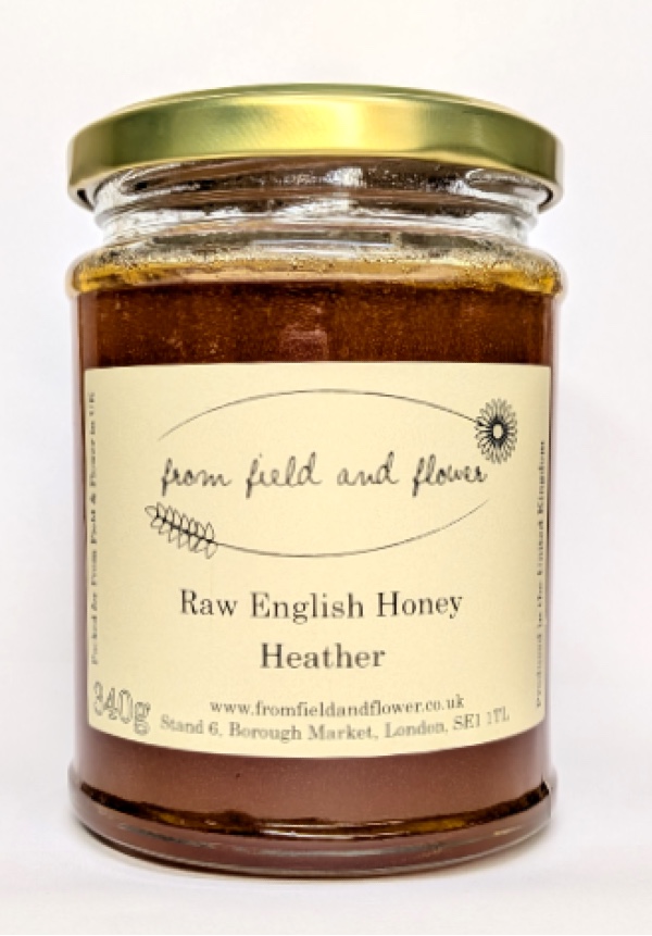 a jar of heather honey on a white background